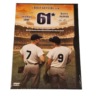 May include: DVD of the film "61*" by Billy Crystal, featuring Thomas Jane and Barry Pepper. The cover shows two baseball players in pinstripe uniforms with the numbers 7 and 9, set against a stadium backdrop.