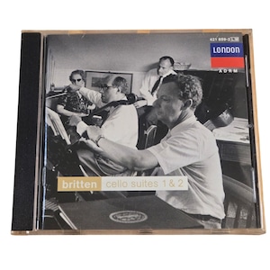 May include: A CD case featuring a black and white image of four men, likely musicians, in a room. The CD case has the text "britten cello suites 1 & 2" and the London label.