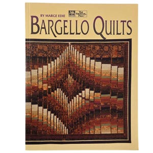 May include: A book titled "Bargello Quilts" by Marge Edie. The cover features a colorful quilt with a geometric pattern in shades of brown, red, and beige.