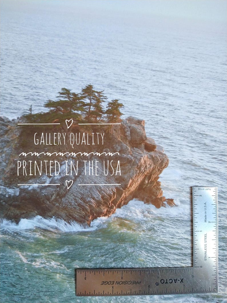 May include: A close-up of a rocky island with trees on top, surrounded by blue water. The text "GALLERY QUALITY PRINTED IN THE USA" is written on the image. A ruler is visible in the bottom right corner.