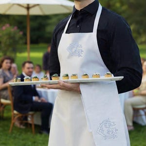 May include: A white ceramic mug with a black handle and the text "But First, Coffee" in a bold, black font. The mug is likely 11-15 ounces, perfect for a morning beverage. The design is simple and modern.