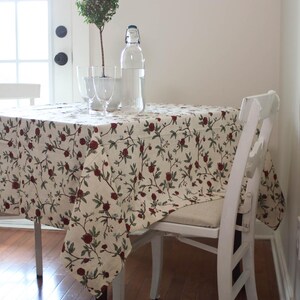 Square red floral mahjong table cloth in cotton linen, designed for card games, bridge, and holiday gatherings. Washable and reusable, this durable table cover protects your table while adding charm. Use as a Christmas table cloth, rehearsal dinner linen, or game table cover. Perfect for poker nights, casual family meals, or festive entertaining. Inspired by William Morris prints, this card tablecloth blends practicality with timeless style for every season.