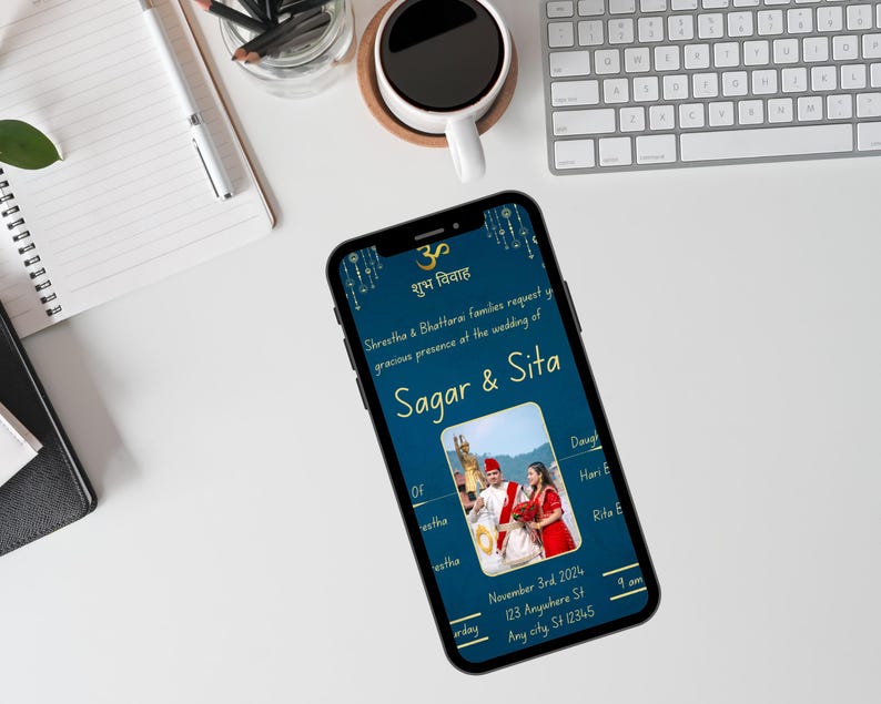 May include: A blue and gold wedding invitation featuring a photograph of the couple in traditional Indian clothing. The invitation includes the names Sagar & Sita, the date 3rd November 2024, and the time 4 am. The address is 123 Anywhere St, Any city St 12345.