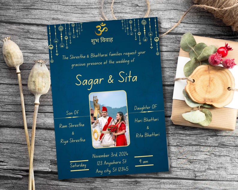 May include: A blue wedding invitation with gold accents and a photograph of the couple. The invitation reads "Sagar & Sita" and includes the date, time, and location of the wedding. The text "शुभ विवाह" is also included on the invitation.
