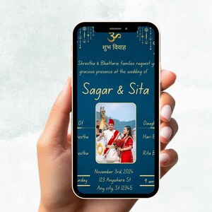 May include: A blue and gold wedding invitation displayed on a smartphone screen. The invitation features a photograph of a couple in traditional Indian attire, the text "शुभ विवाह" (meaning "auspicious marriage"), and the names "Sagar & Sita". The invitation also includes the date, time, and location of the wedding.