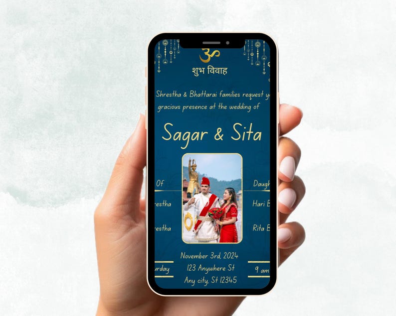 May include: A blue and gold wedding invitation displayed on a smartphone screen. The invitation features a photograph of a couple in traditional Indian attire, the text "शुभ विवाह" (meaning "auspicious marriage"), and the names "Sagar & Sita". The invitation also includes the date, time, and location of the wedding.