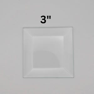 May include: A white 3-inch square glass tile with a beveled edge.