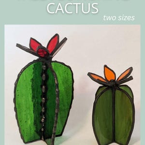 May include: Two stained glass cactus sculptures, one tall and one small, with green bodies and red and orange flower accents. The text "TALL FLOWERING CACTUS" and "two sizes" are at the top. The text "SAGE GLASSWORK" is at the bottom.