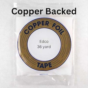 May include: A roll of copper foil tape, 36 yards long, with the brand name "Copper Foil Tape" printed in blue on a gold background. The label also says "Edco" and "Made in U.S.A."