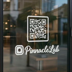 May include: A glass door with a white QR code and the Instagram logo with the text "Pinnacle Lab" in a cursive font. The door is in a commercial building with a blurred background.