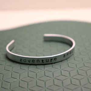 Adventure Awaits Cuff Bracelet – Hand Stamped Aluminum Bracelet – Inspirational Jewelry for Travelers & Dreamers – Gifts– Wanderlust Quote