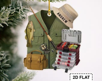 May include: A fishing-themed ornament featuring a green fishing vest, a fishing rod, a tackle box, a tan hat with "ANDREW" printed on it, a brown tackle bag, and a fish. The ornament is designed in a 2D flat style.
