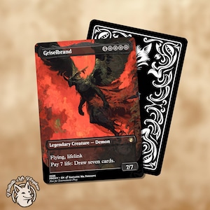 May include: A collectible card featuring a demonic creature with large wings against a red background. The card is labeled "Griselbrand" and includes game text. A black card with white decorative patterns is behind it.