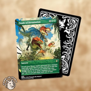 May include: A Magic: The Gathering card titled "Finale of Devastation" showing a vibrant illustration of dinosaurs in a green setting. The card has a green border and text detailing its sorcery effect. A black card with white decorative swirls is behind it.