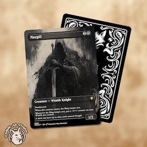 May include: A black and white trading card titled Nazgûl, depicting a hooded figure holding a sword. The card text includes Creature - Wraith Knight, Deathtouch, and game rules. A second card shows a black back with white ornate floral patterns.