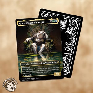 May include: A fantasy card featuring a frog-like creature, Glarb, Calamity's Augur, seated on a throne. The card has a black border with text and a 2/4 power/toughness rating. A second card with a decorative black and white design is behind it.