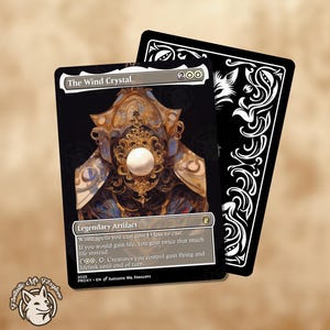 May include: A black card featuring the text "The Wind Crystal" and a detailed illustration of a golden, ornate object with a white orb. The card's back is black with white decorative patterns. A small logo of a fox is in the corner.