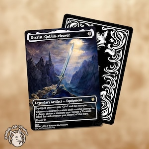 May include: A rectangular trading card titled Orcrist, Goblin-cleaver featuring a sword illustration against a mountain landscape. The card text includes Legendary Artifact - Equipment, game rules, and a black back with white ornate floral patterns.