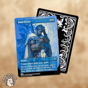 May include: A blue "Brain Freeze" card featuring a man in armour, and a black card with white decorative elements. The "Brain Freeze" card has text that reads "Instant" and "Storm". A white and brown logo is in the bottom left corner.