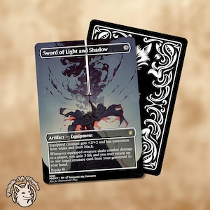 May include: A Magic: The Gathering card titled "Sword of Light and Shadow" with a fantasy illustration. The card features a dark figure wielding a sword, with text describing its abilities. A black card with white decorative patterns is behind it.