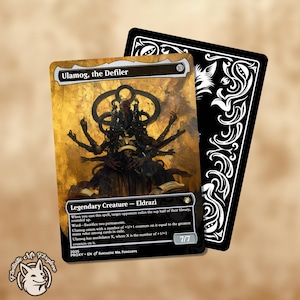 May include: A black and gold Magic: The Gathering card featuring Ulamog, the Defiler, a legendary Eldrazi creature with multiple arms and a large, menacing head. The card has a power and toughness of 7/7 and includes text describing its abilities.