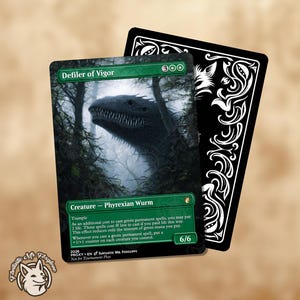 May include: A collectible card featuring a dark, menacing creature emerging from a misty forest. The card, titled "Defiler of Vigor," has a green border and includes the text "Creature - Phyrexian Wurm." A black card with white decorative elements is behind it.
