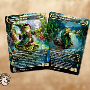 May include: Two collectible trading cards featuring "Helga, Skittish Seer." The cards show a frog druid in a green robe, set against a detailed fantasy background with text. The cards have a 1/3 power/toughness.