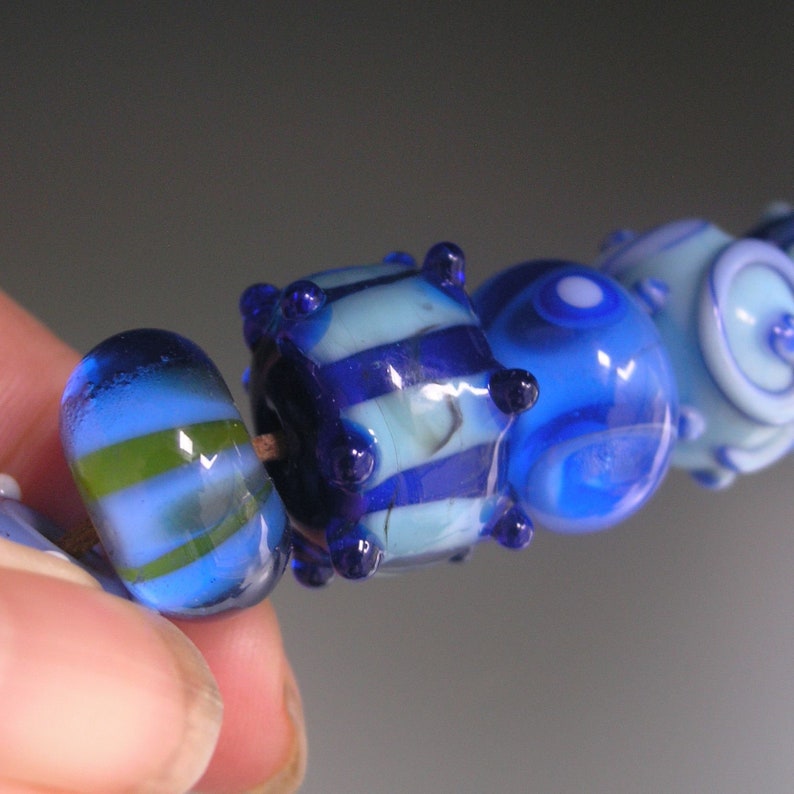 Blue Boro Lampwork Orphan Beads Turquoise Dots Stripes Swirls Light and Dark Blue Yellow Accents 12 Bead Set