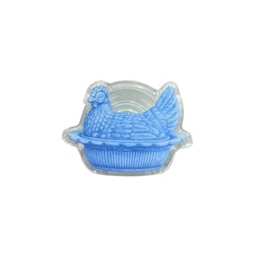 May include: A white ceramic mug with a black handle and the text "But First, Coffee" in a bold, black font. The mug is set against a blurred background, suggesting a cozy setting. The mug appears to be approximately 4 inches tall.