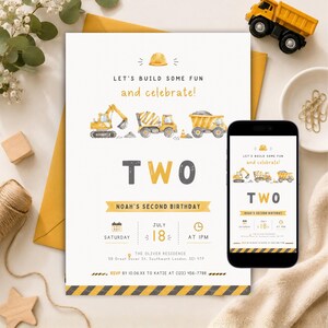 May include: A birthday invitation card and a smartphone displaying the same design, featuring watercolour construction vehicles, a yellow hard hat icon, and the text "LET'S BUILD SOME FUN and celebrate!" with "TWO" and "NOAH'S SECOND BIRTHDAY".