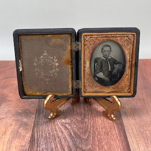 Antique Daguerreotype / Ambrotype Photograph Portrait of a Young Victorian Bordered by a Gold Frame in a Leather Case