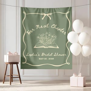 May include: Sage green backdrop with the text "Her Next Chapter" and "Sophia's Bridal Shower" in a delicate script. A floral illustration emerges from an open book. White balloons and gift boxes complete the scene.