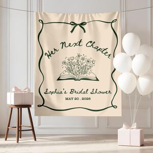May include: A beige backdrop with dark green text and a decorative border. The text reads "Her Next Chapter" and "Sophia's Bridal Shower, May 20, 2026." A floral illustration is in the center. White balloons and gift boxes are also present.