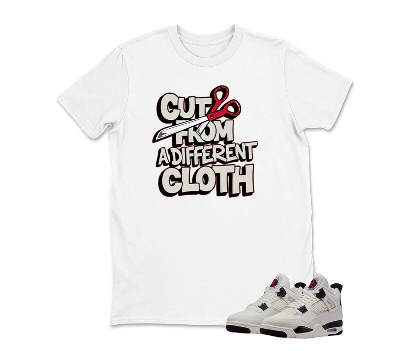May include: White t-shirt with the text "CUT FROM A DIFFERENT CLOTH" in a bold, outlined font, featuring scissors. Below the shirt are white and black sneakers with red accents. The overall theme is streetwear fashion.