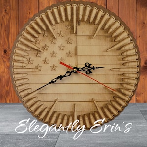May include: A wooden clock with a red, white, and blue American flag design. The clock face is surrounded by a ring of bullet casings. The clock hands are black and red.