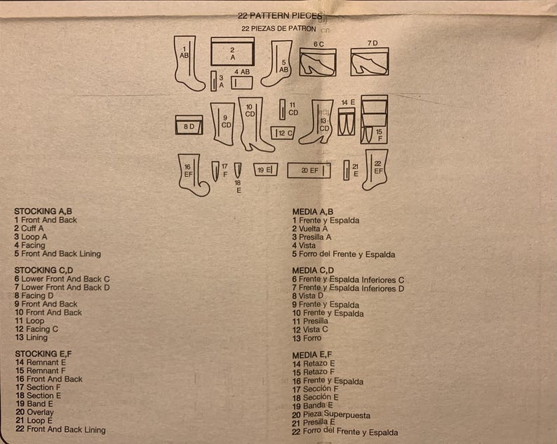 May include: A beige sewing pattern instruction sheet titled 22 PATTERN PIECES, featuring black line drawings of twenty-two distinct stocking components labeled 1 through 22, with corresponding English and Spanish text lists detailing each part.