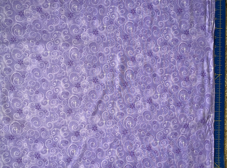 May include: Purple fabric with a white swirl pattern. The fabric has a subtle shimmer.