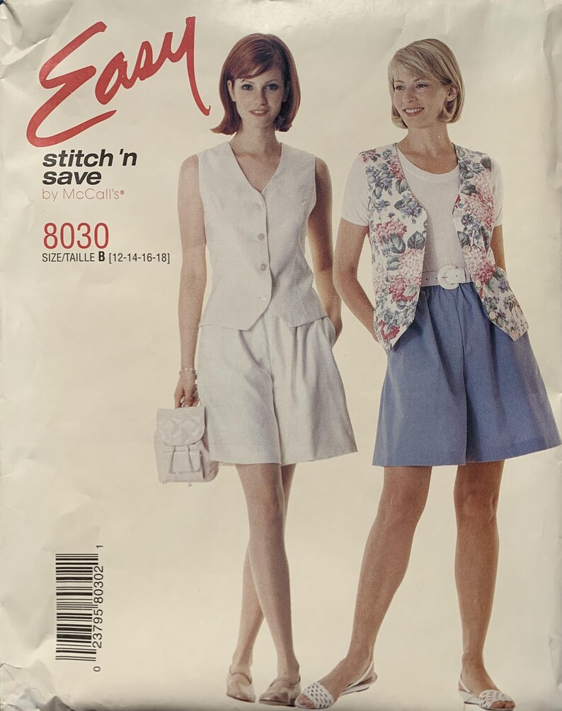 May include: A vintage sewing pattern labelled "Easy stitch 'n save by McCall's" showing two women in outfits. One wears a white vest and shorts, the other a floral vest and blue shorts. The pattern number is 8030, size B.