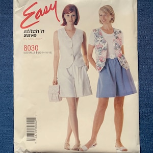 May include: A vintage sewing pattern labelled "Easy stitch 'n save by McCall's 8030." The pattern shows two women modelling outfits. One wears a white vest and shorts, the other a floral vest and blue skirt. The size is B [12-14-16-18].