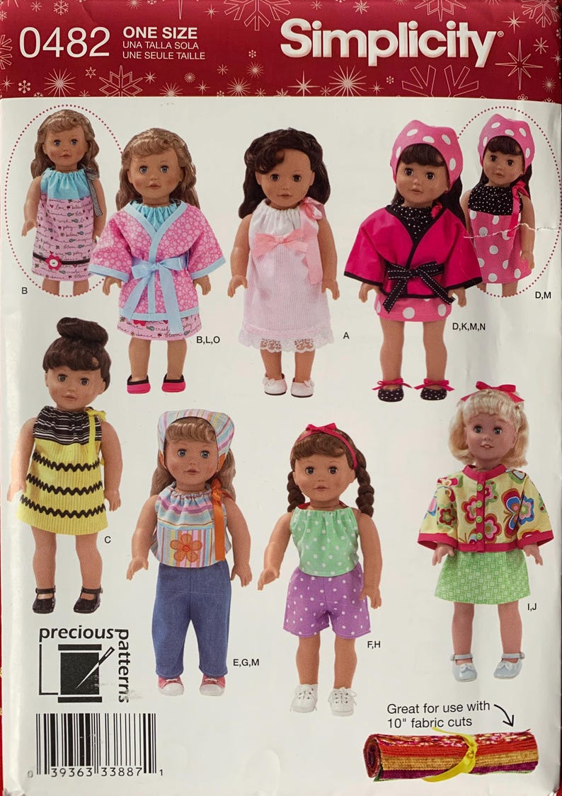 May include: A Simplicity 0482 sewing pattern envelope featuring illustrations of dolls wearing various handmade outfits including dresses, tops, pants, and jackets. The package includes the text Precious Patterns and a barcode.