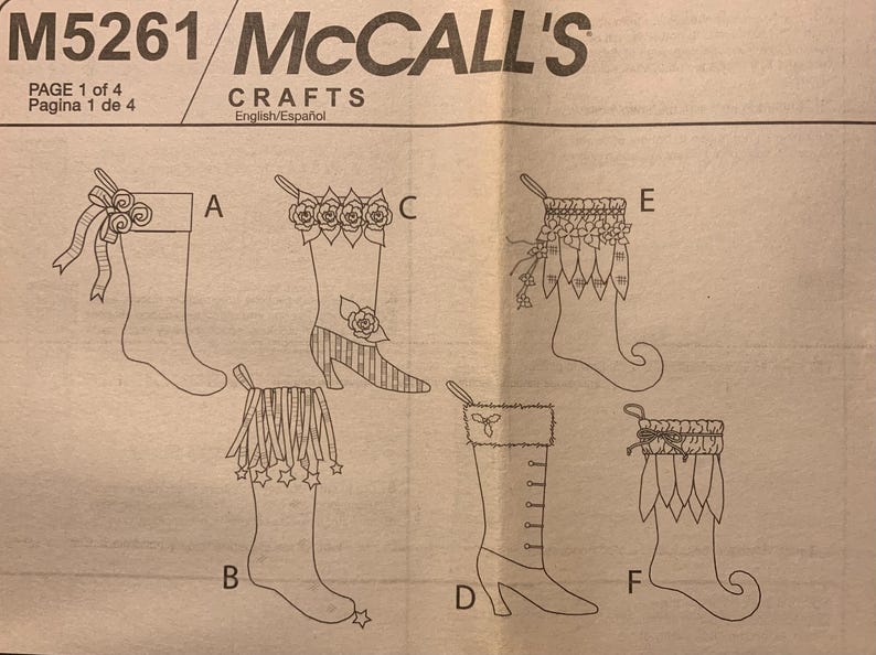 May include: McCall's M5261 Crafts sewing pattern sheet featuring line drawings of six different Christmas stocking designs labeled A through F. The illustrations show various decorative elements including bows, flowers, fringe, stars, and cuffs on different stocking shapes.