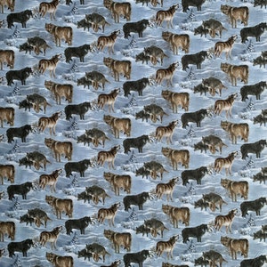 May include: A patterned fabric featuring numerous wolves in shades of brown and black, set against a light blue snowy backdrop. Some wolves are depicted howling. Small evergreen trees are also included in the design.