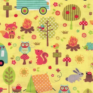 May include: Yellow fabric with a camping theme. Features a raccoon in a camper, a red car, a fox, an owl, a squirrel, a tent, and a campfire. Includes the text "CAMP FIRE". The fabric has a repeating pattern of trees, flowers, and animals.