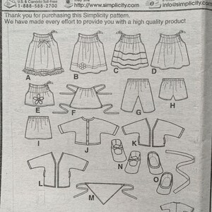 May include: A Simplicity 0482/2302 sewing pattern instruction sheet featuring line drawings of various garments including skirts, shorts, tops, a jacket, a bandana, and shoes, labeled with letters A through O for assembly guidance.