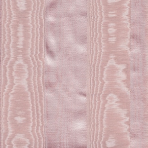 May include: Close-up of a pink fabric with vertical stripes and a subtle sheen. The fabric has a textured appearance with varying widths of stripes. A wooden ruler with inch measurements is at the bottom. The text "Cindy Chock's Sewing Room" is visible.