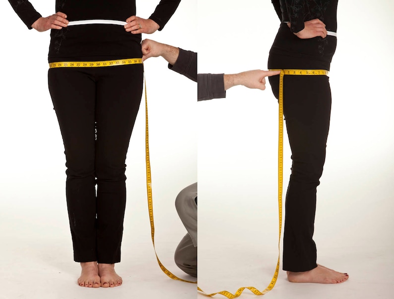 May include: Two women are standing with a measuring tape around their waists. The tape measure is yellow and has black markings. The women are wearing black pants and are standing on a white background.