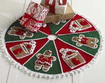 May include: A crocheted Christmas tree skirt with a white crocheted border. The skirt is decorated with gingerbread men and houses in red, brown, and white.