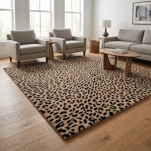 May include: A large rectangular area rug featuring a repeating leopard print pattern in shades of tan, brown, and black. The rug is positioned on a light-coloured wooden floor, covering a significant portion of the space beneath the furniture.