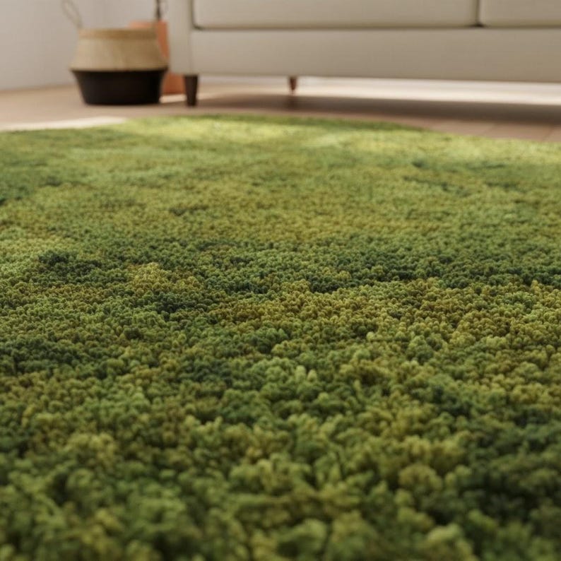 May include: A green shag rug with varying shades of green, creating a textured, plush appearance. The rug is in a room with a white sofa and a woven basket.