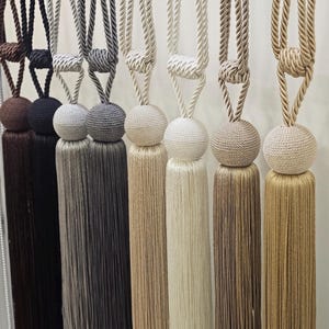 Boho gardinband med tofsar - set om 2 - vävt rep